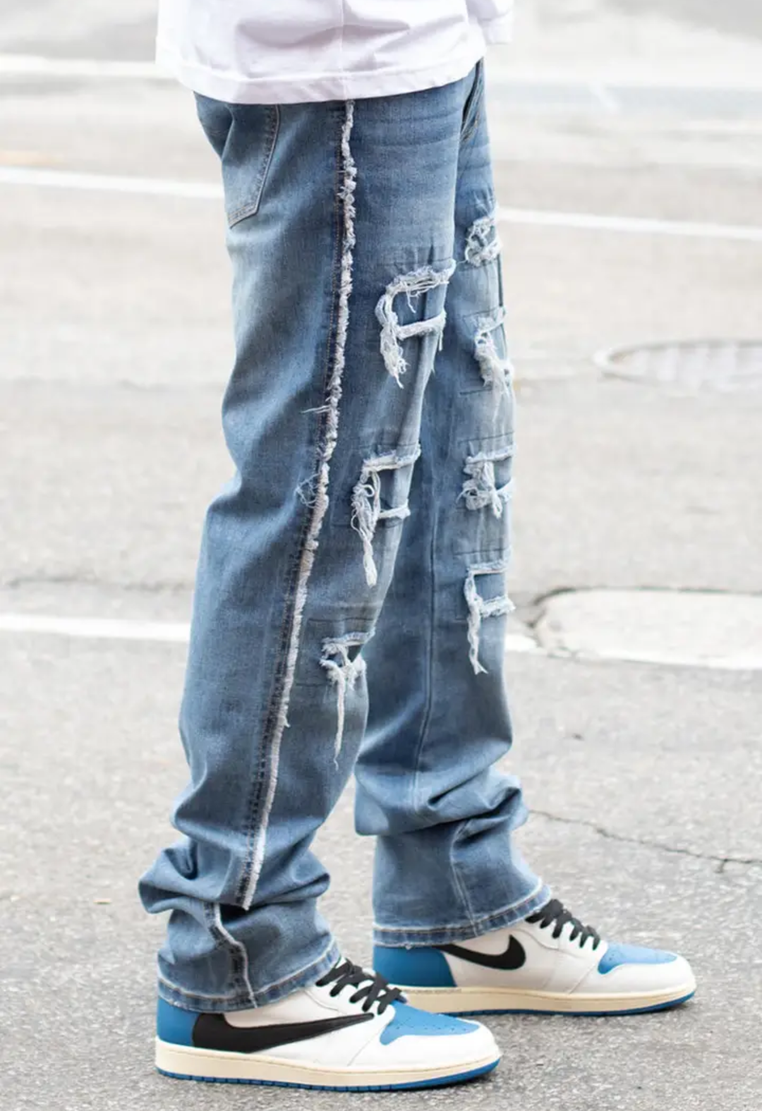 Expertly crafted with a mid high thread count for superior softness and durability, our exclusive Side Raw Edge Rip & Repair Raw Denim Jeans are a must-have for any wardrobe. The slim fit and comfort-stretched denim offer both style and comfort, while the distressed details and raw edges add a touch of edge to any look. Made with 97% cotton and 3% spandex, these indigo blue jeans are the perfect addition to your wardrobe.